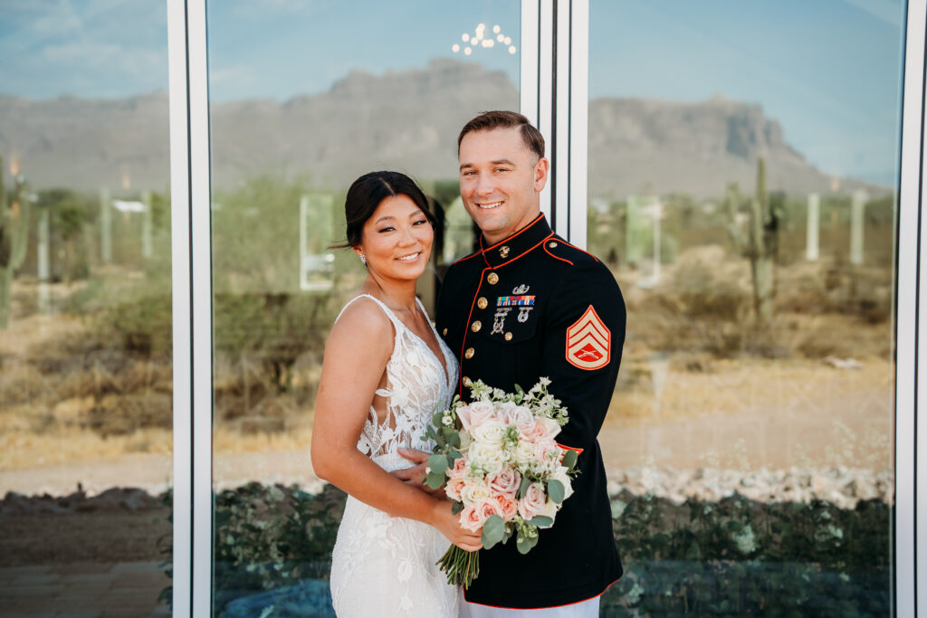 bride and groom formal photos, groom in navy uniform, military wedding, white and pink rose bouquet