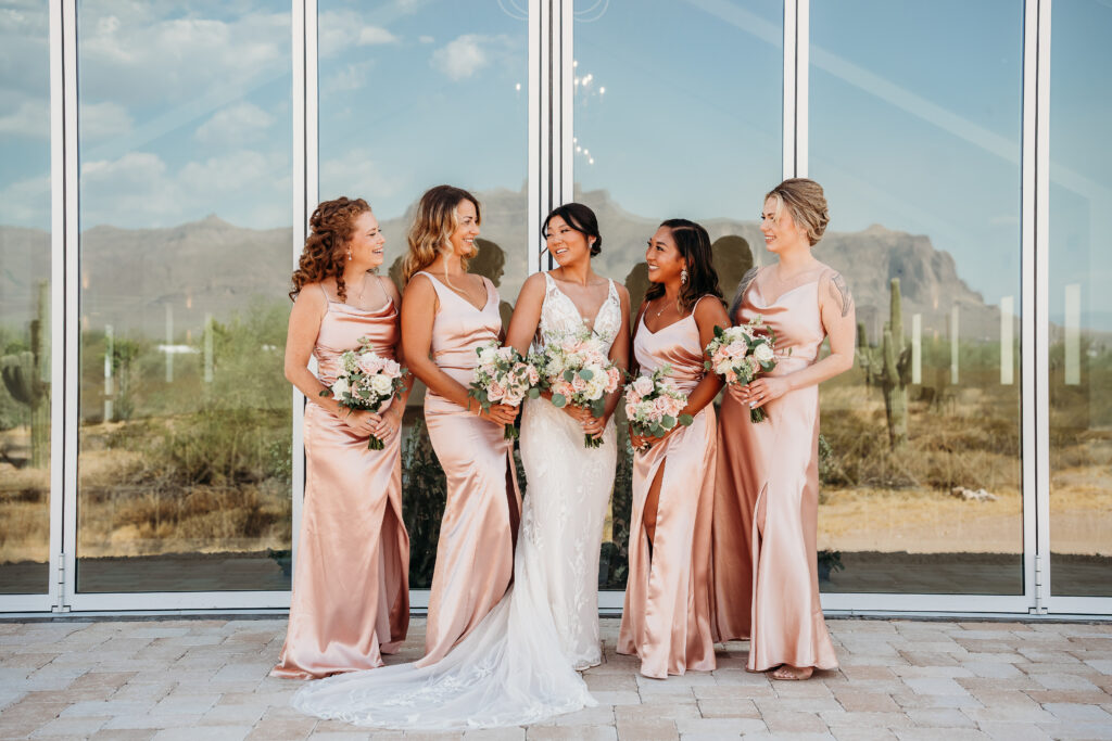 bridemaids posing ideas,long pink bridesmaid dresses, pink and white rose bouquets, arizona wedding photographer