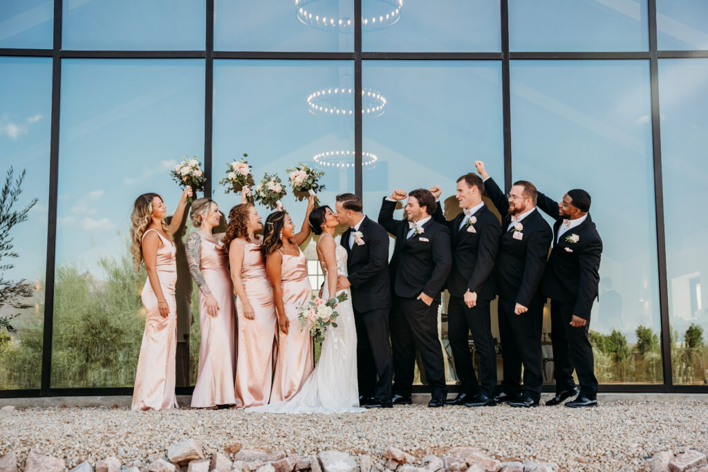 Bridal party poses, pink bridesmaid dresses, rose bouquets, arizona wedding photographer