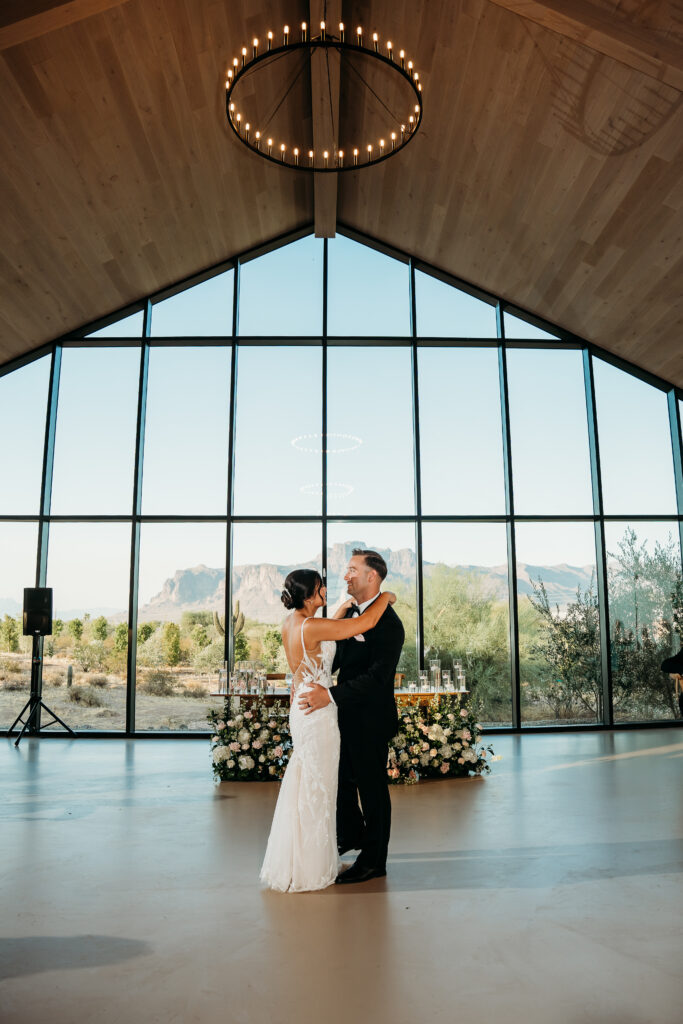 Desert View Weddings & Events, bride and groom first dance, groom in black tuxedo, wedding reception views of the mountains