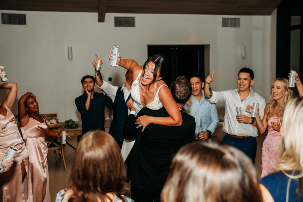 Desert View Weddings & Events Reception, bride being thrown in air, wedding reception dancing