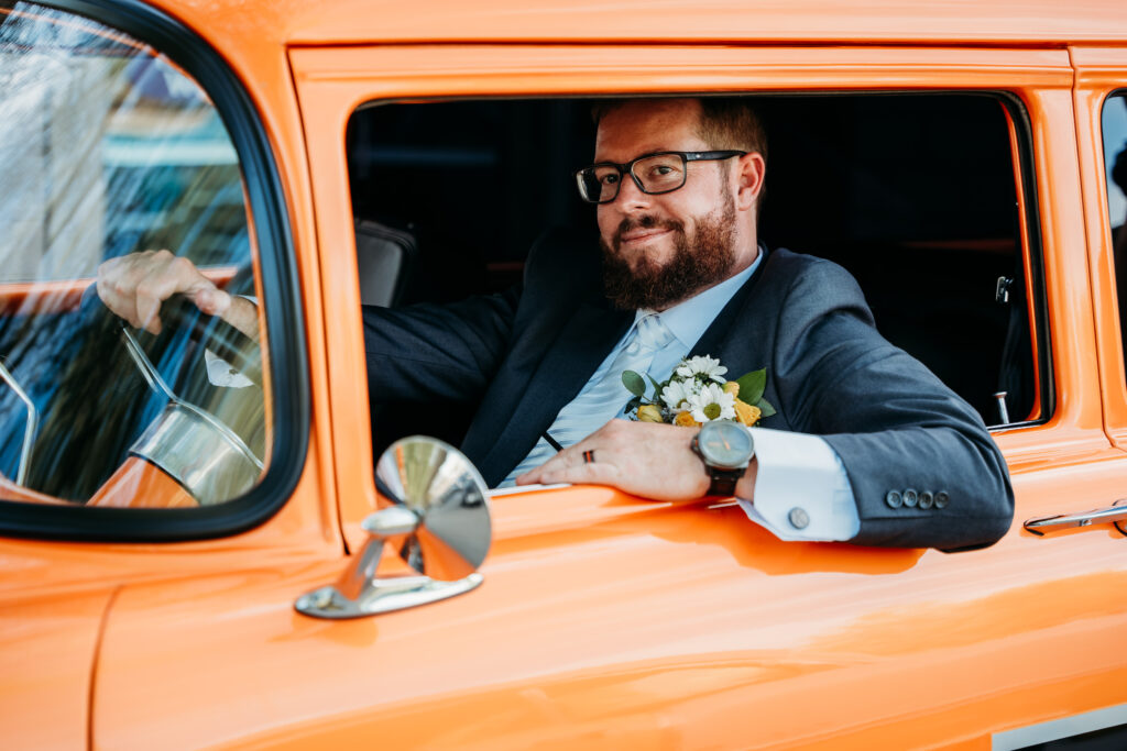 groom in orange classic car, classic car and groom, arizona wedding photographer