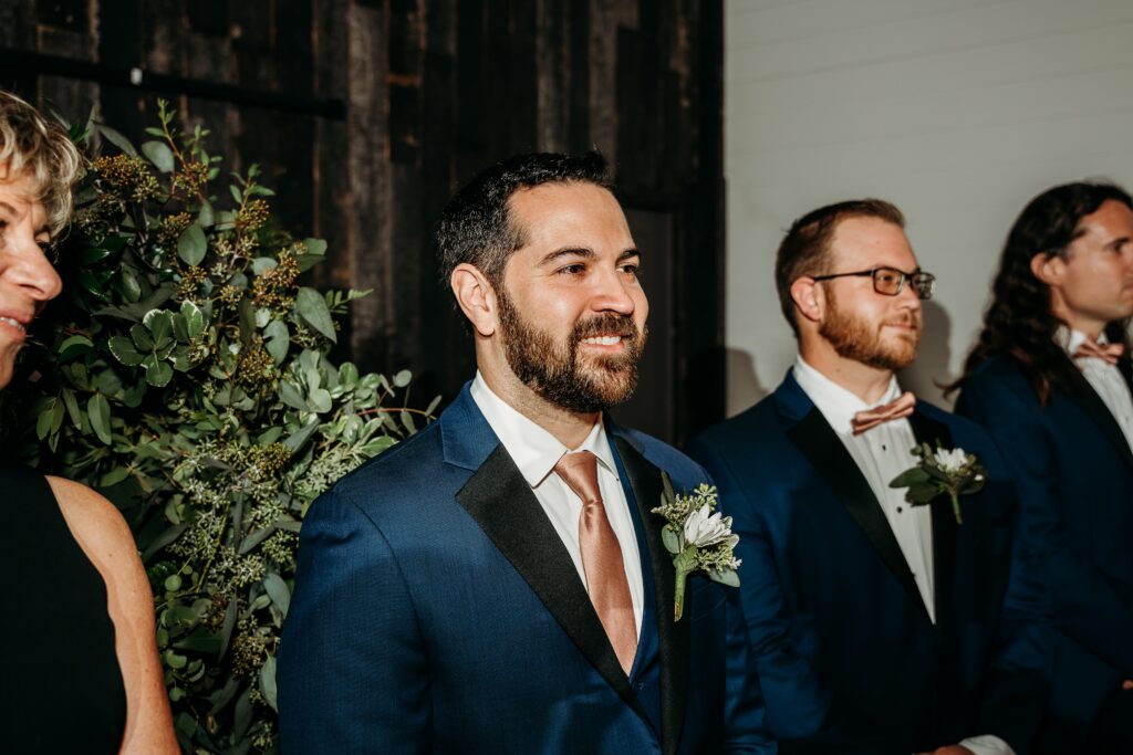 fire house event center ceremony, arizona wedding photographer, groom seeing bride walk down aisle
