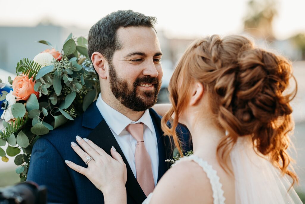 bride and groom posing ideas, arizona wedding photographer, groom in navy blue tux, bride in plunge neck line