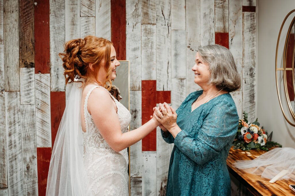 Bride getting ready at fire house even center with mom