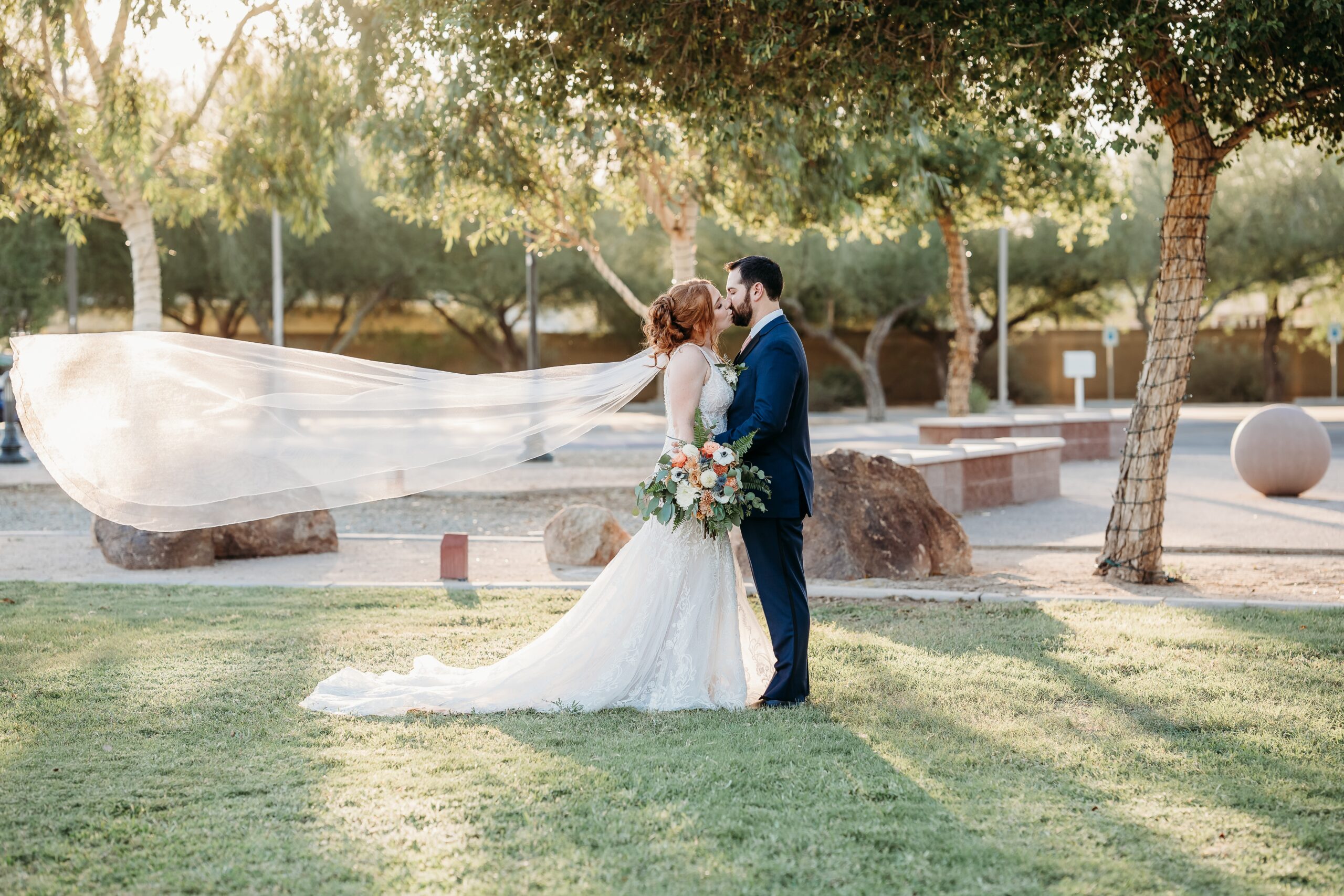 bride and groom posing ideas, arizona wedding photographer, groom in navy blue tux, bride in plunge neck line