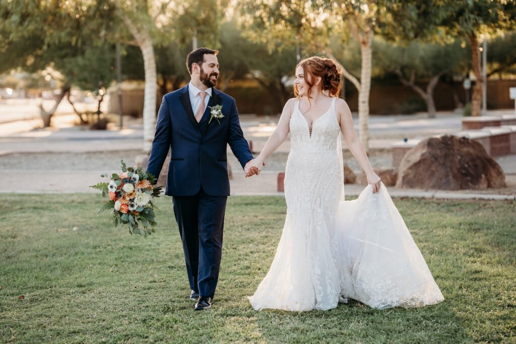 bride and groom posing ideas, arizona wedding photographer, groom in navy blue tux, bride in plunge neck line
