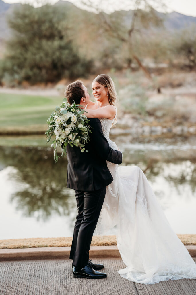 Bride and Groom Posing Ideas,  bride and groom dessert wedding, verrado golf club wedding, arizona wedding photographer, groom swooping up bride for portaits