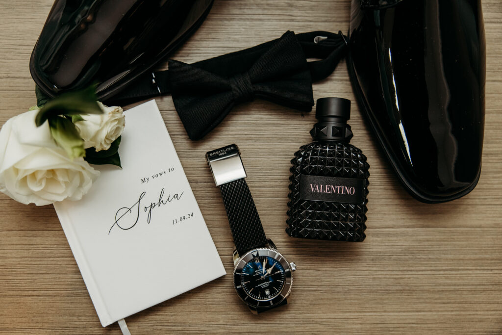 Flay lay for groom, groom  wedding details, grooms vows to bride, colgne, watch