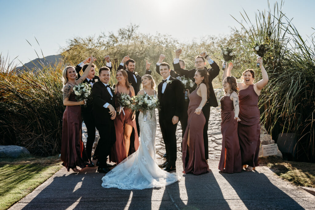Wedding party posing ideas, arizona dessert wedding, wedding party cheering for bride and groom